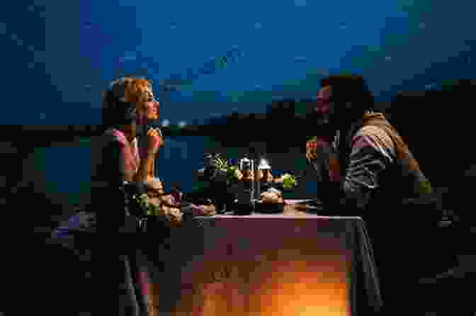 A Couple Enjoying A Romantic Dinner By Candlelight. How To Kiss A Girl For The First Time: Tips About Kissing