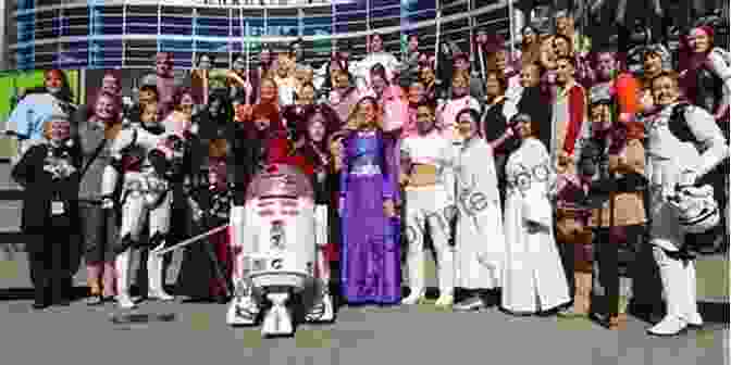 A Group Of Star Wars Fans Gathered At A Convention, Dressed In Elaborate Costumes And Sharing Their Passion For The Saga, Capturing The Vibrant And Inclusive Nature Of The Fandom. The World According To Star Wars