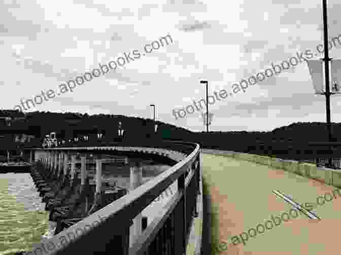 A Panoramic View Of The Big Dam Bridge, A Historic Landmark And Pedestrian Walkway Spanning The Arkansas River Trails Of Little Rock: Hiking Biking And Kayaking Trails In Little Rock