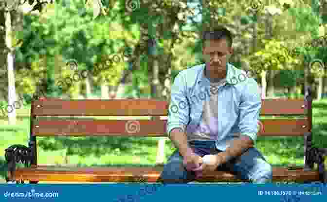 A Pensive Young Man Sitting Alone On A Park Bench, Lost In Thought. The Man Who Saws Us In Half: Poems (Southern Messenger Poets)