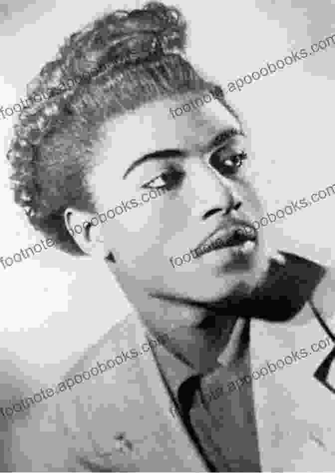 A Young Little Richard In The 1950s, Wearing A Black Suit And Holding A Microphone, With A Confident And Charismatic Expression. The Life And Times Of Little Richard: The Authorized Biography