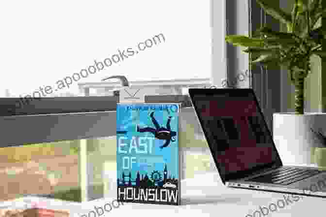 East Of Hounslow Book Cover Featuring A Young Man Sitting On A Bench In A Park, Looking Out Into The Distance, With A Cityscape In The Background. East Of Hounslow (Jay Qasim 1)