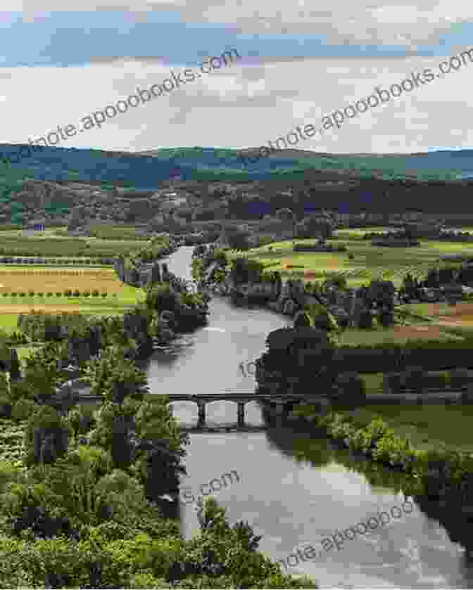 Scenic View Of The Dordogne River And Lush Green Hills Le Roc A Village On The Dordogne